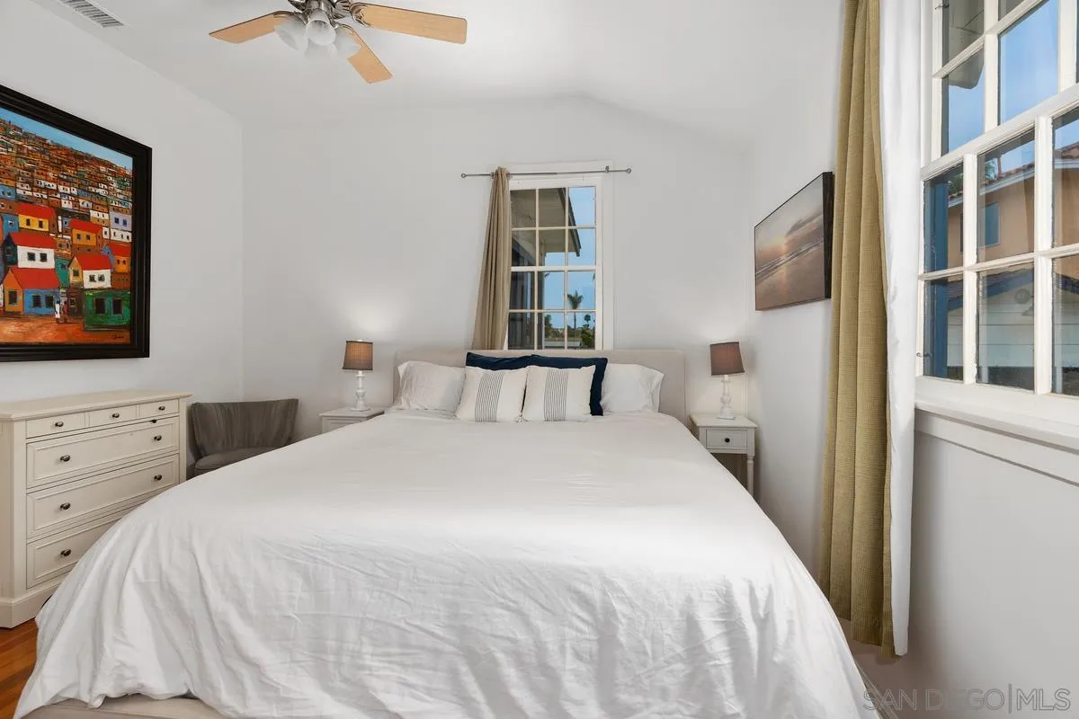 215 North Rios Avenue Solana Beach, CA 92075 - Photo 11 of 23 a bedroom with a bed and a flat screen tv