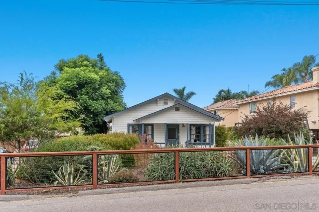 front view of a house with a small yard