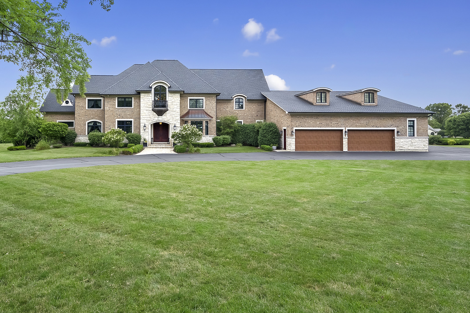 8511 Kearney Road Downers Grove, IL 60516 - Photo 2 of 71 a front view of a house with a garden and porch