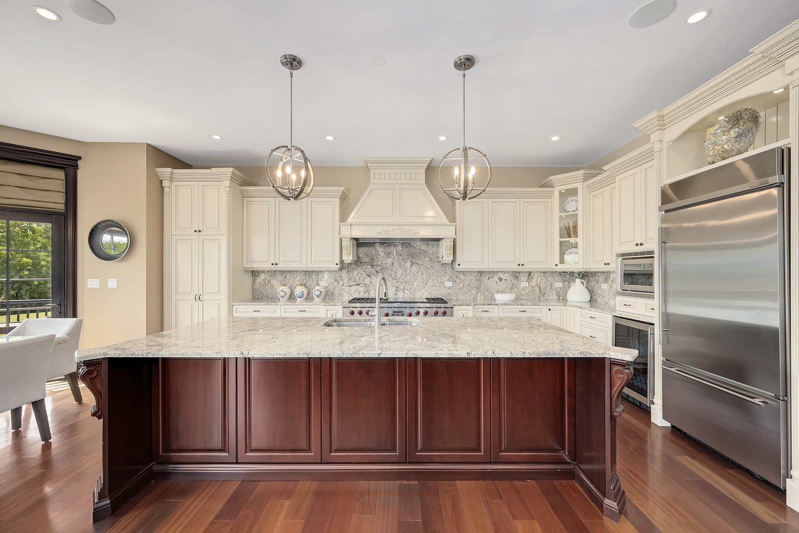 8511 Kearney Road Downers Grove, IL 60516 - Photo 25 of 71 a kitchen with kitchen island granite countertop wooden floor stainless steel appliances and cabinets