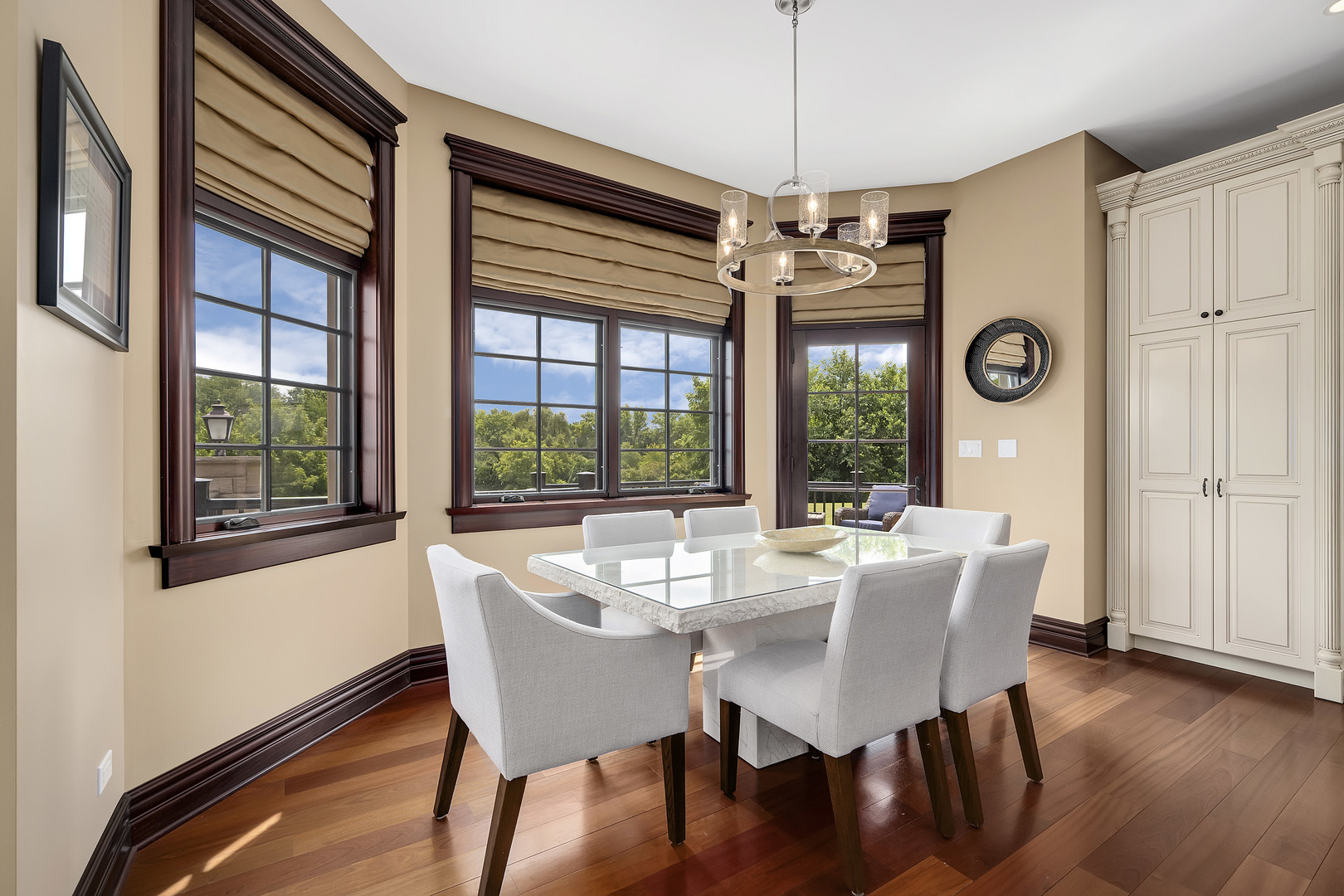 8511 Kearney Road Downers Grove, IL 60516 - Photo 29 of 71 a dining room with furniture wooden floor and a chandelier