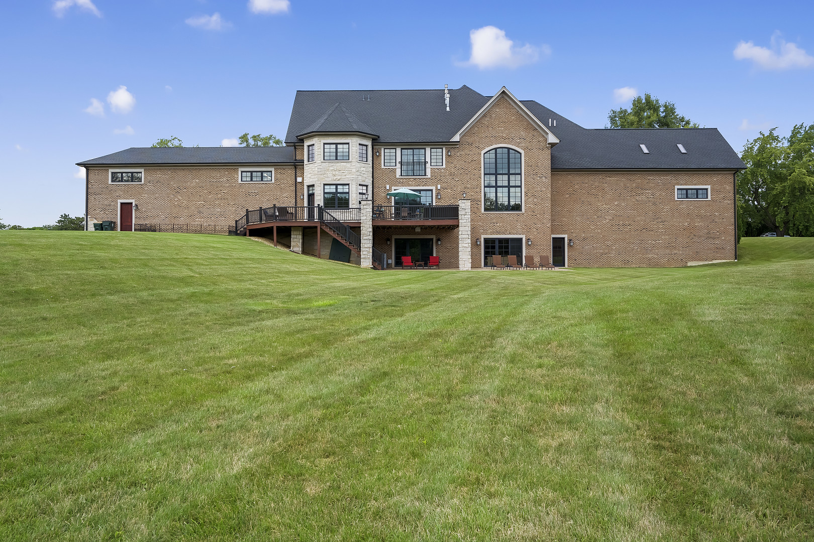 8511 Kearney Road Downers Grove, IL 60516 - Photo 5 of 71 a front view of a house with a garden and yard