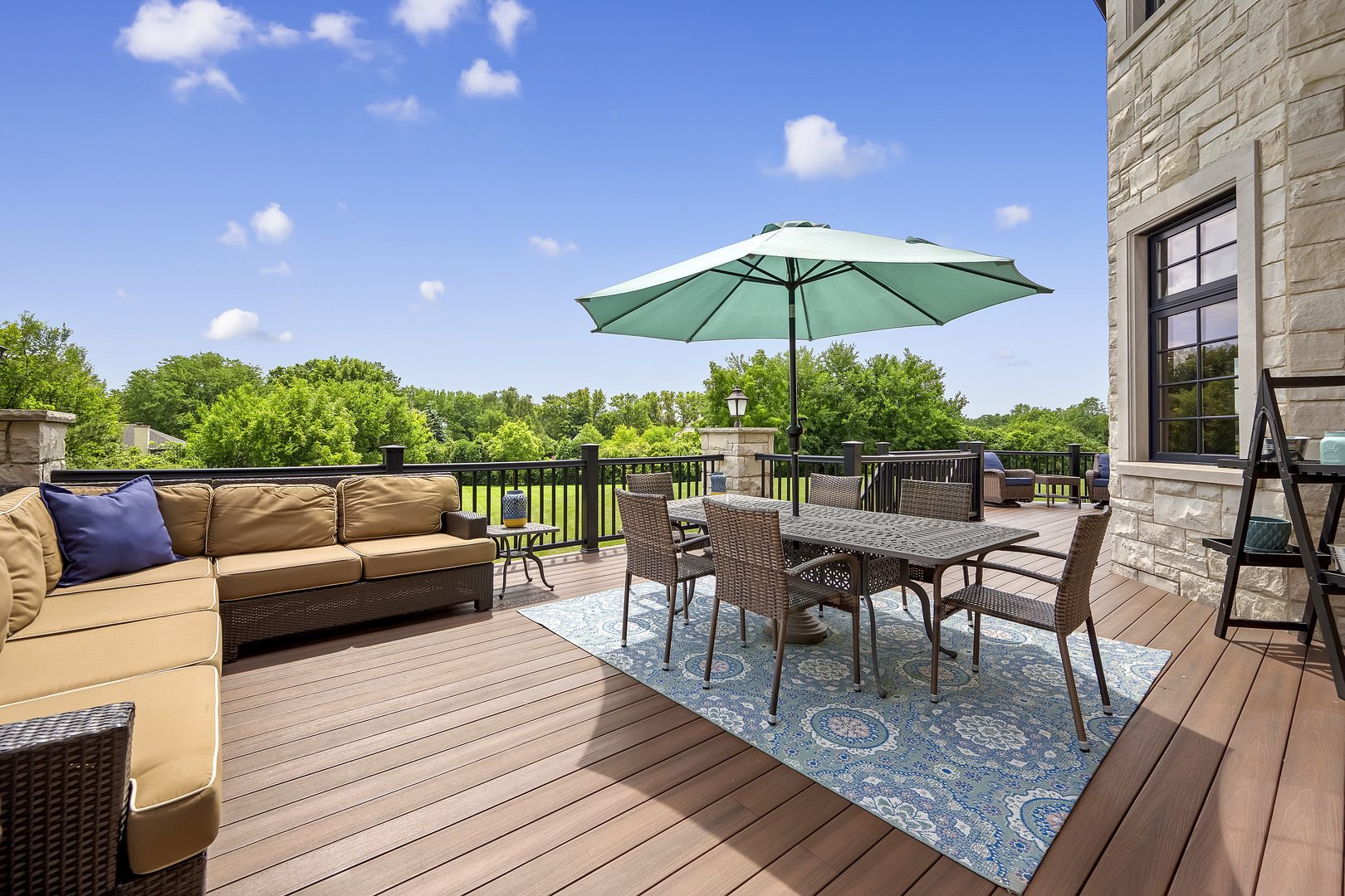 8511 Kearney Road Downers Grove, IL 60516 - Photo 7 of 71 a view of a roof deck with table and chairs under an umbrella with wooden floor