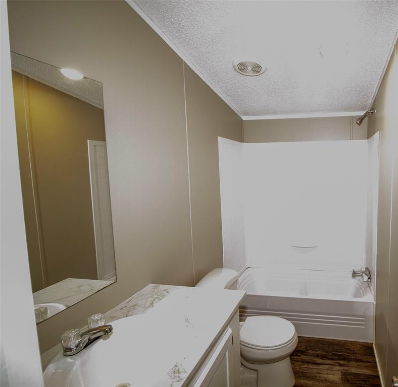 909 Old Arcadia Road Minden, LA 71055 - Photo 16 of 21 a bathroom with a sink a toilet and shower