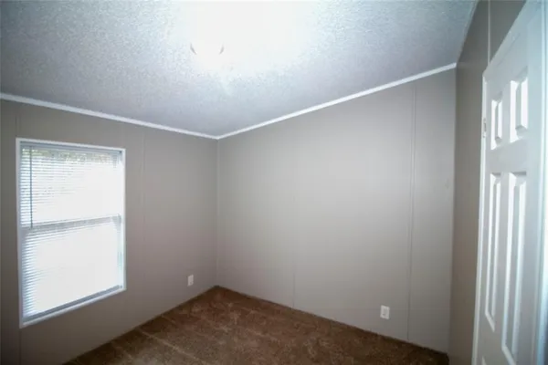 an empty room with closet area