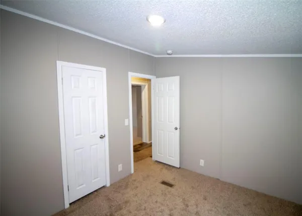 an empty room with closet area