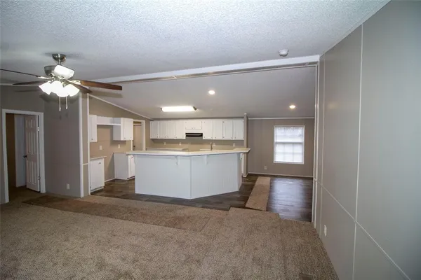a view of a kitchen with a sink and a window