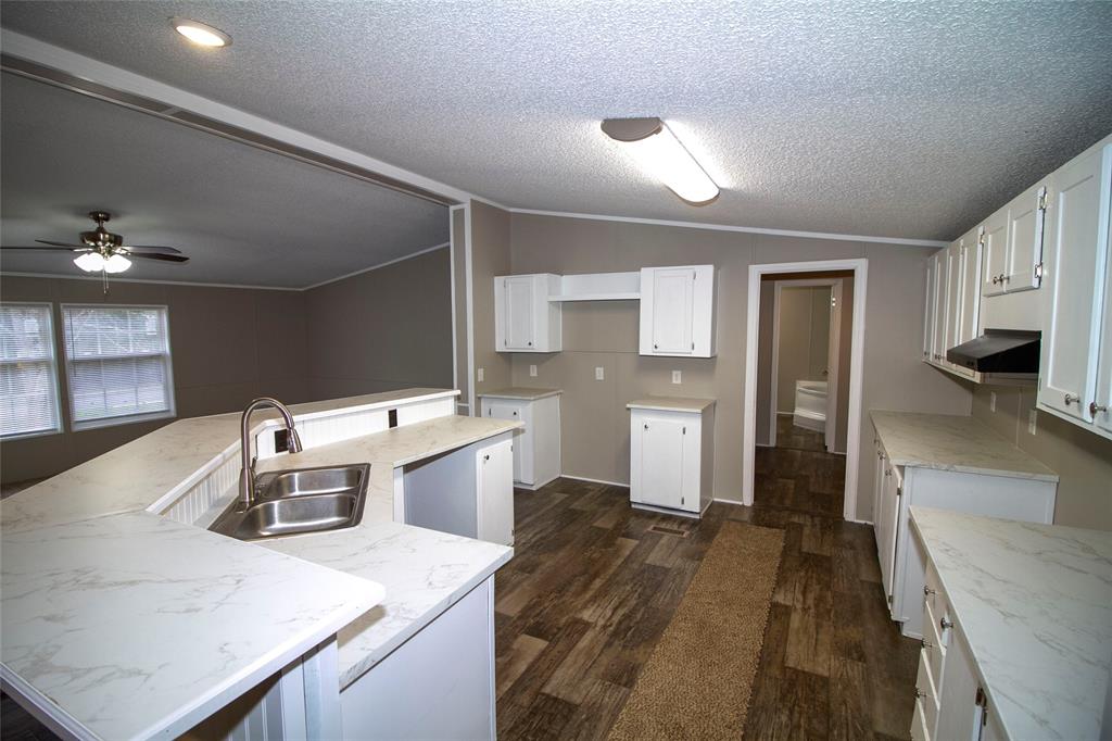 909 Old Arcadia Road Minden, LA 71055 - Photo 8 of 21 a kitchen that has a lot of cabinets and refrigerator