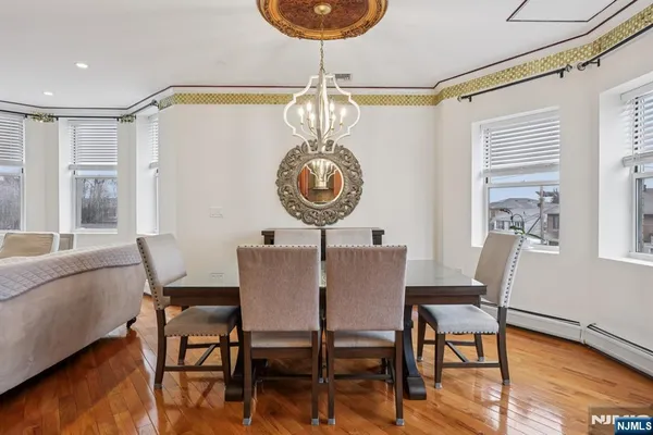 a living room with stainless steel appliances kitchen island granite countertop furniture and a kitchen view