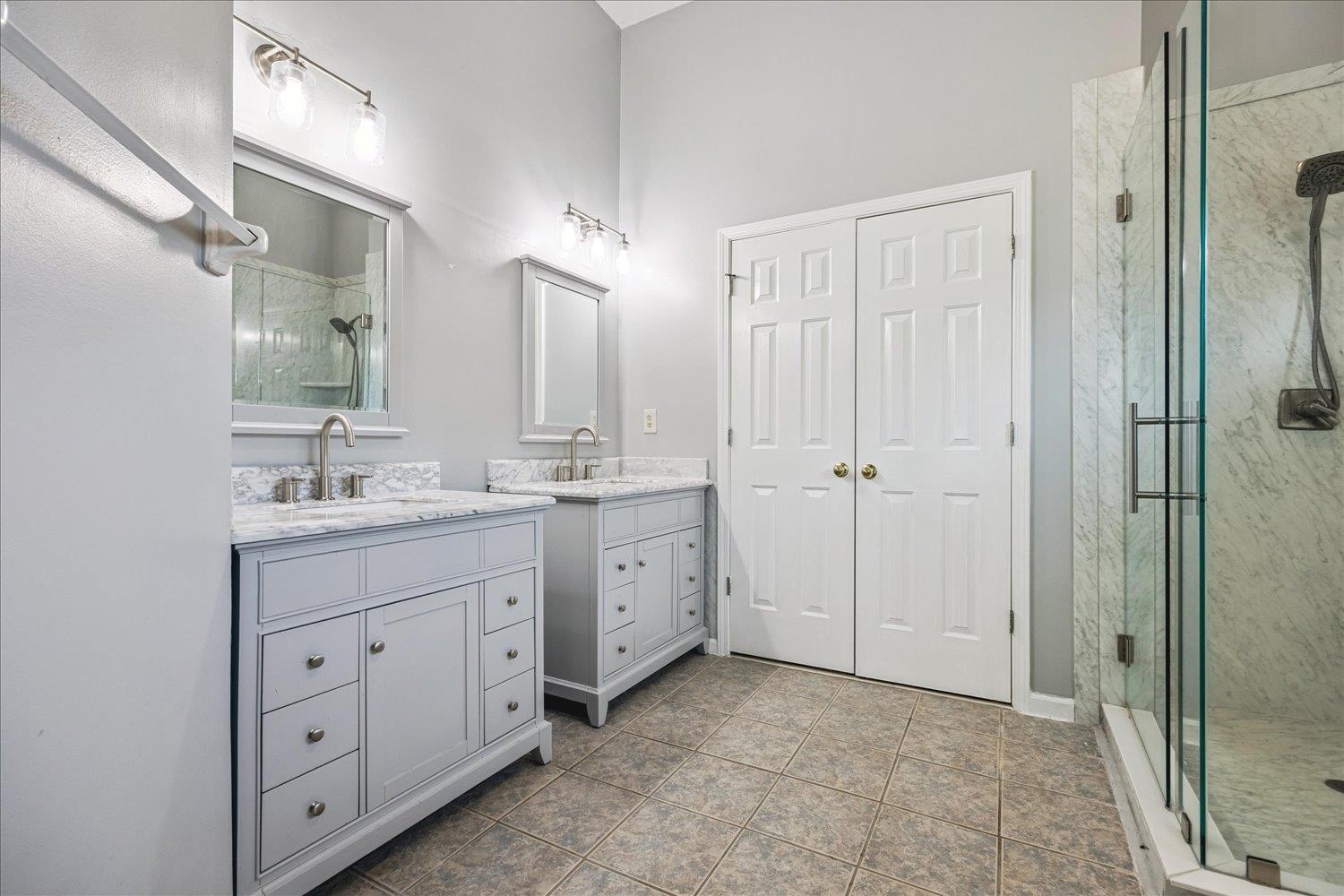 4654 Shadow Wick Lane Bartlett, TN 38002 - Photo 17 of 26 Bathroom featuring dual vanity sinks with light-toned cabinetry and stone countertops