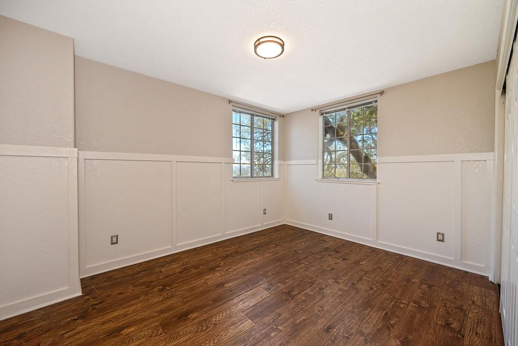 3154 Twin K Road Pilot Hill, CA 95664 - Photo 56 of 89 a view of an empty room with wooden floor and a window