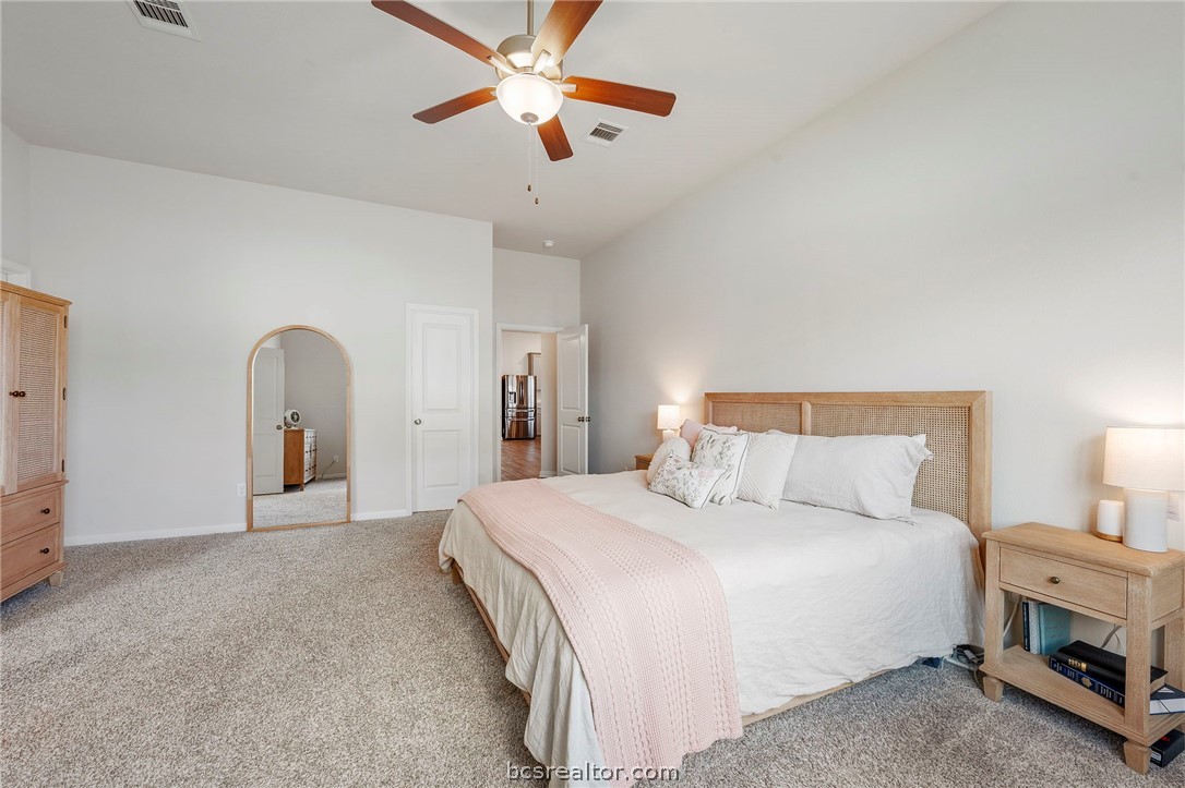 2038 Viva Road Bryan, TX 77807 - Photo 11 of 21 Oversized primary suite offering room for a sitting area and peaceful comfort.