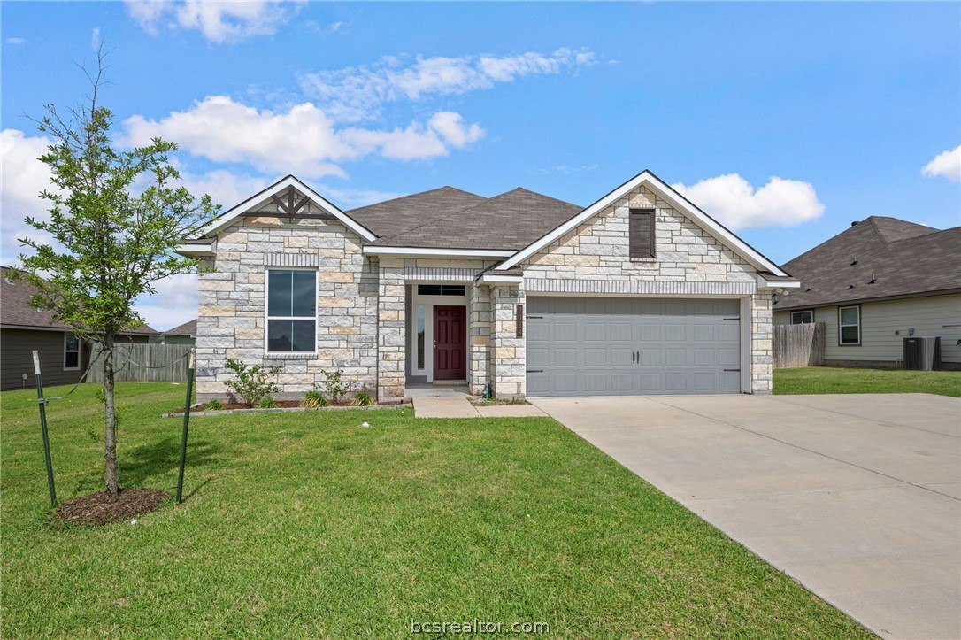 2038 Viva Road Bryan, TX 77807 - Photo 2 of 21 Spacious driveway and clean modern exterior create a polished first impression.