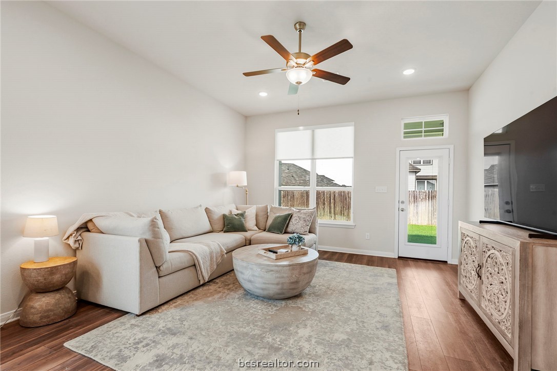 2038 Viva Road Bryan, TX 77807 - Photo 6 of 21 Comfortable open-concept living room filled with natural light and easy access to the patio.