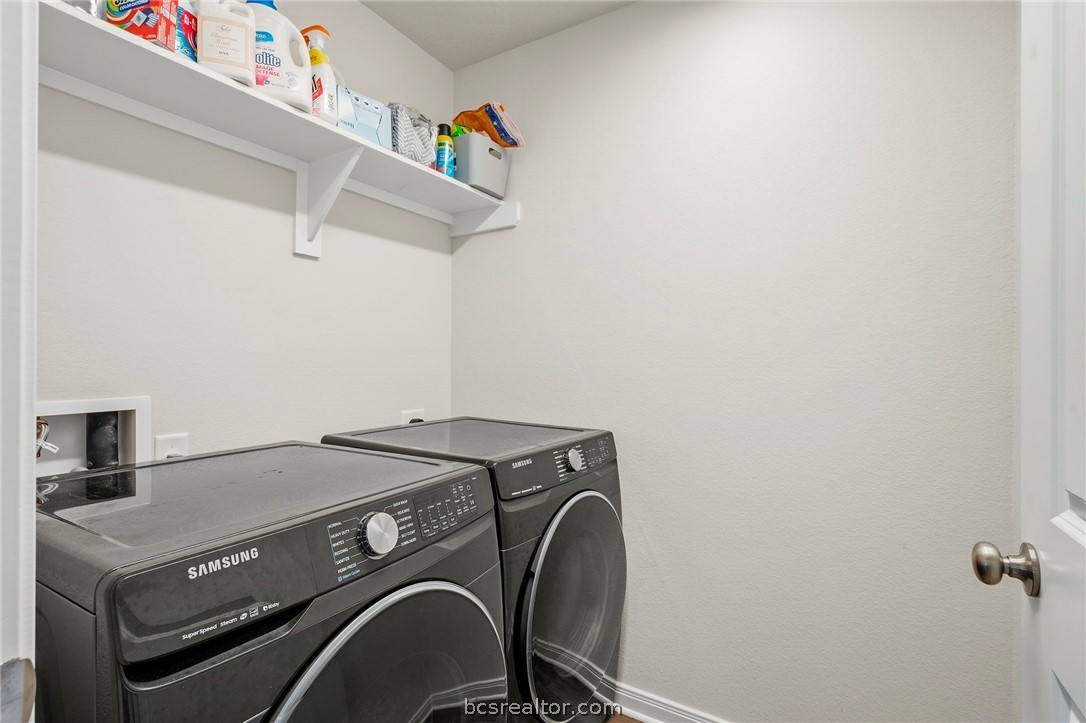 2038 Viva Road Bryan, TX 77807 - Photo 9 of 21 Dedicated laundry room with shelving and convenient workspace.