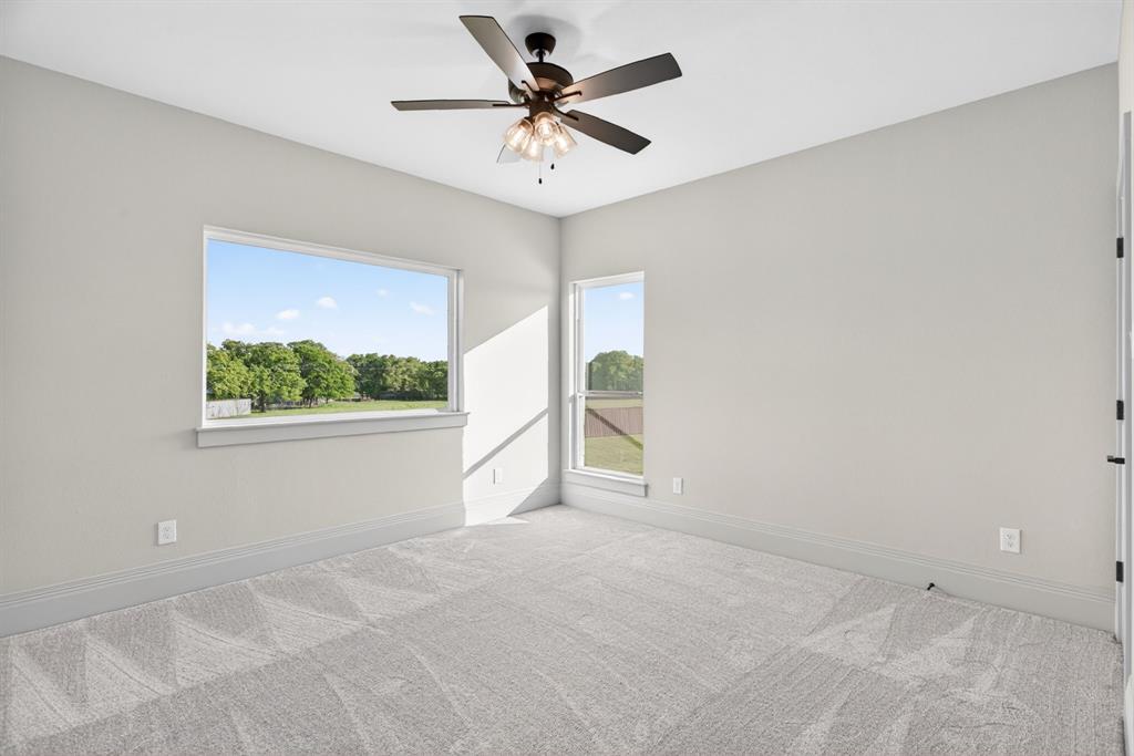 7798 Barber Rnch Road Fort Worth, TX 76126 - Photo 31 of 40 a view of a livingroom with a ceiling fan and window
