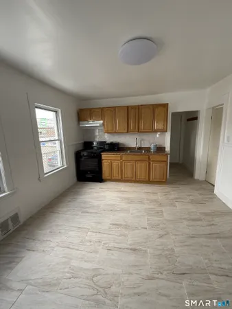 a large kitchen with a stove