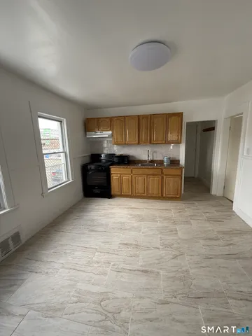 a large kitchen with a stove