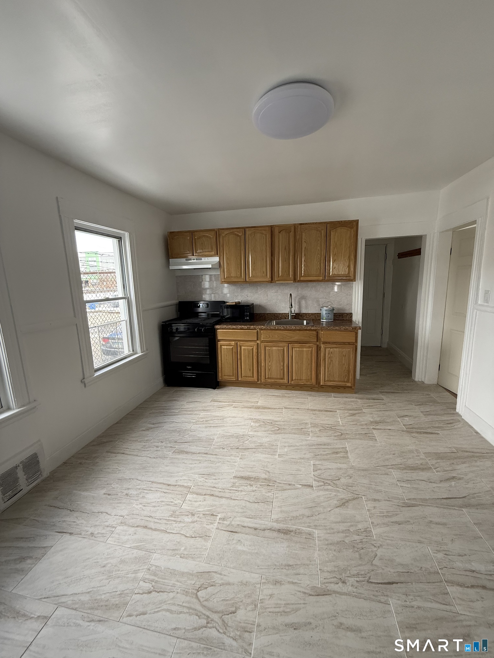 29 Hubbell Street Bridgeport, CT 06605 - Photo 5 of 8 a large kitchen with a stove