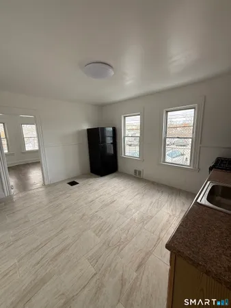 a view of an empty room and window