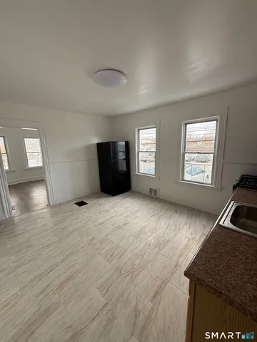 a view of an empty room and window