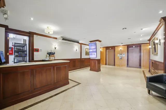 a large room with lots of counter space and windows