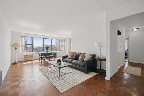 a living room with furniture and a table