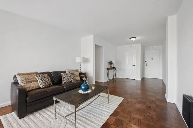 a living room with furniture and a rug