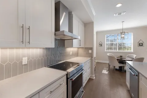 a kitchen that has a lot of cabinets in it