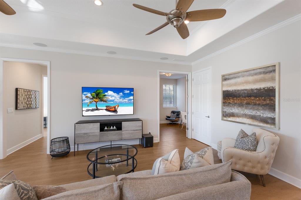 8035 St Simons Street, Unit 8035 University Park, FL 34201 - Photo 7 of 39 a living room with furniture and a flat screen tv