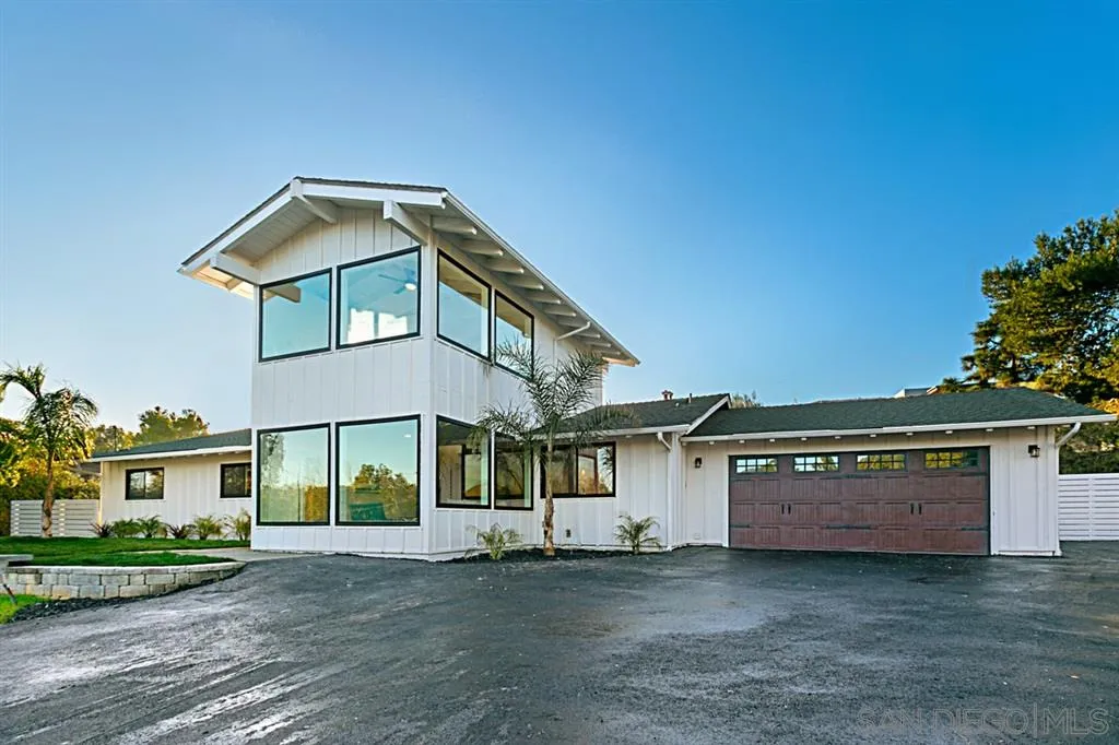 2760 Lone Jack Road Encinitas, CA 92024 - Photo 1 of 25 a front view of a house with a garden and yard