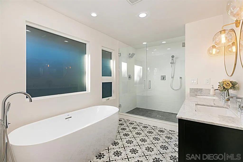 2760 Lone Jack Road Encinitas, CA 92024 - Photo 13 of 25 a bathroom with a bathtub shower sink and mirror