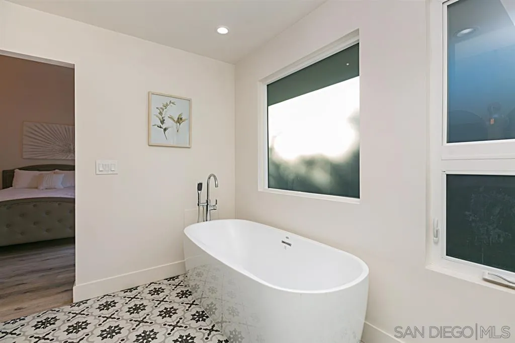 2760 Lone Jack Road Encinitas, CA 92024 - Photo 14 of 25 a white bath tub sitting next to a bathroom sink