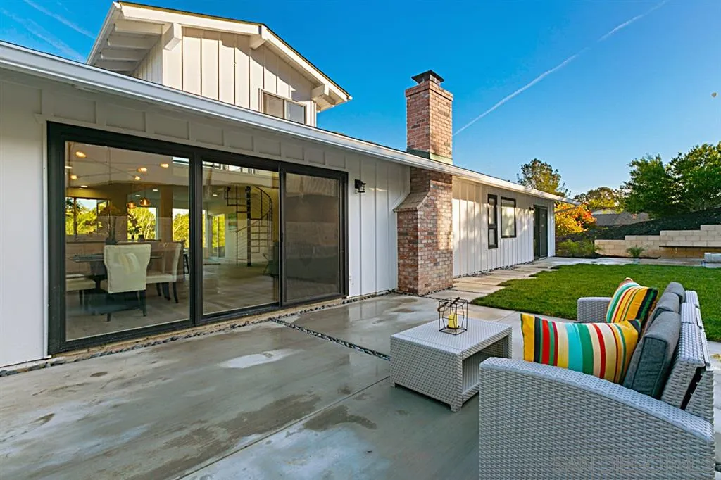 2760 Lone Jack Road Encinitas, CA 92024 - Photo 19 of 25 a view of a patio with couches table and chairs and garden