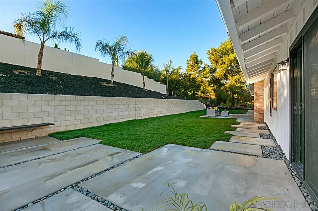 2760 Lone Jack Road Encinitas, CA 92024 - Photo 22 of 25 a view of a house with a yard
