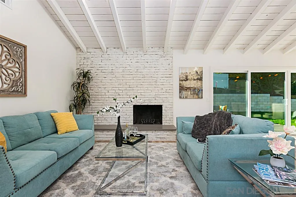 2760 Lone Jack Road Encinitas, CA 92024 - Photo 4 of 25 a living room with furniture and a fireplace