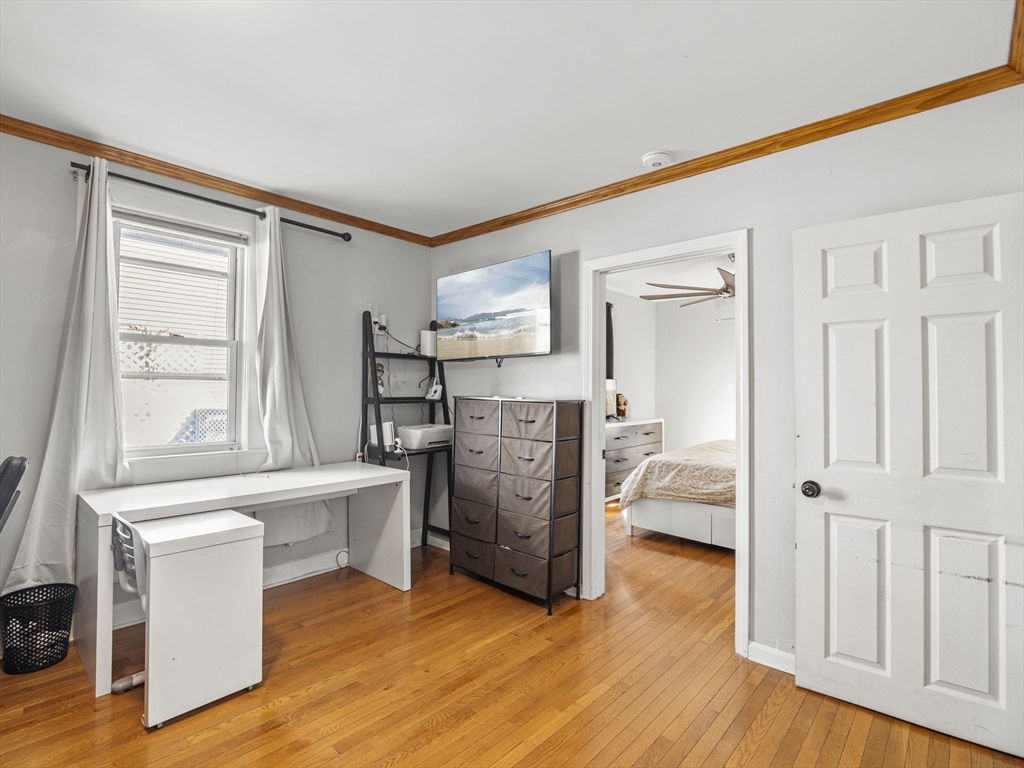95 South Highland Street Lowell, MA 01852 - Photo 16 of 41 a view of a livingroom with furniture and a kitchen