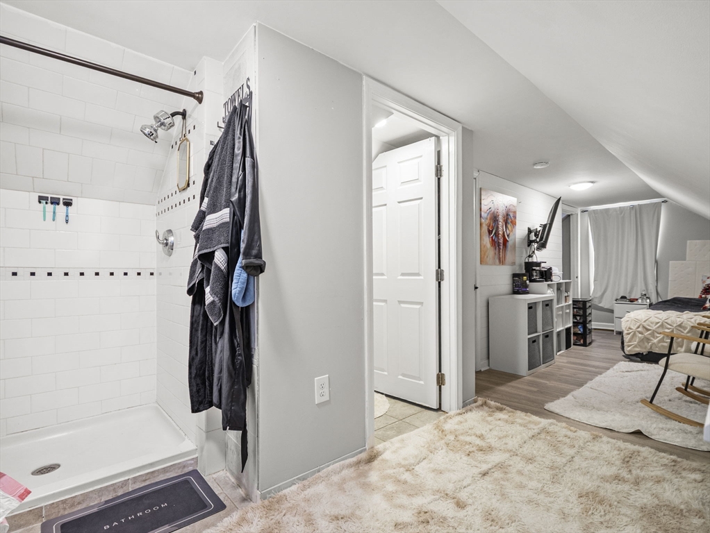 95 South Highland Street Lowell, MA 01852 - Photo 25 of 41 a view of walk in closet with clothes and shoes