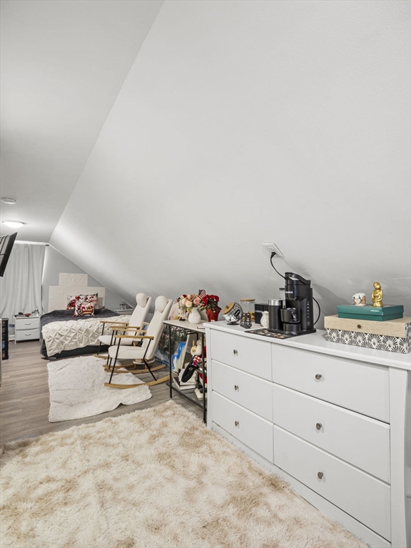 95 South Highland Street Lowell, MA 01852 - Photo 26 of 41 a bedroom with furniture and a bed