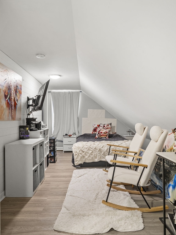 95 South Highland Street Lowell, MA 01852 - Photo 27 of 41 a living room with furniture and wooden floor