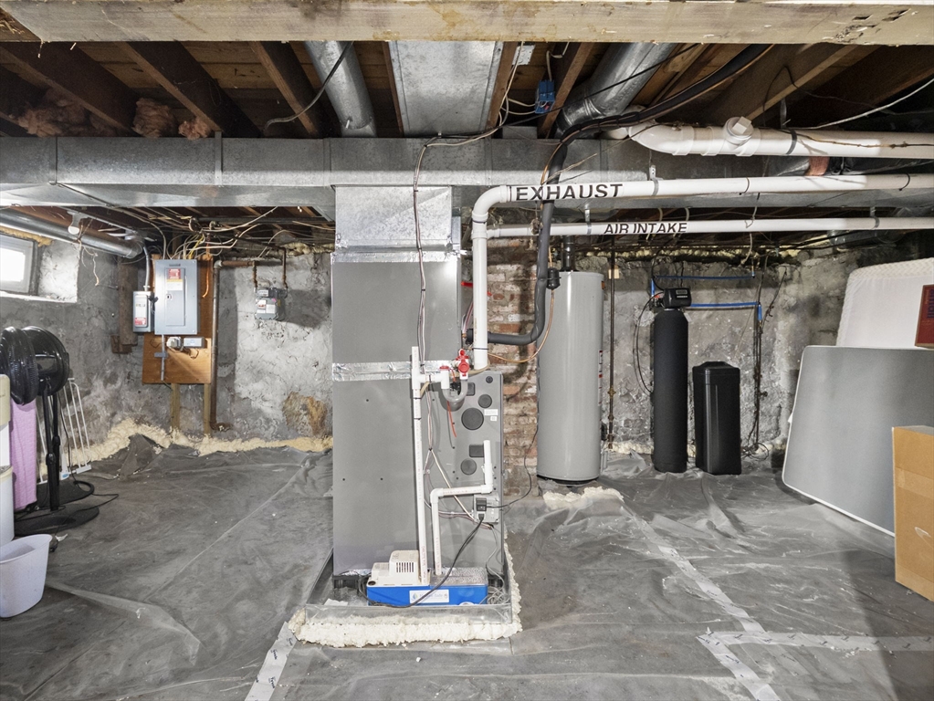95 South Highland Street Lowell, MA 01852 - Photo 31 of 41 a view of a refrigerator with wooden shelves