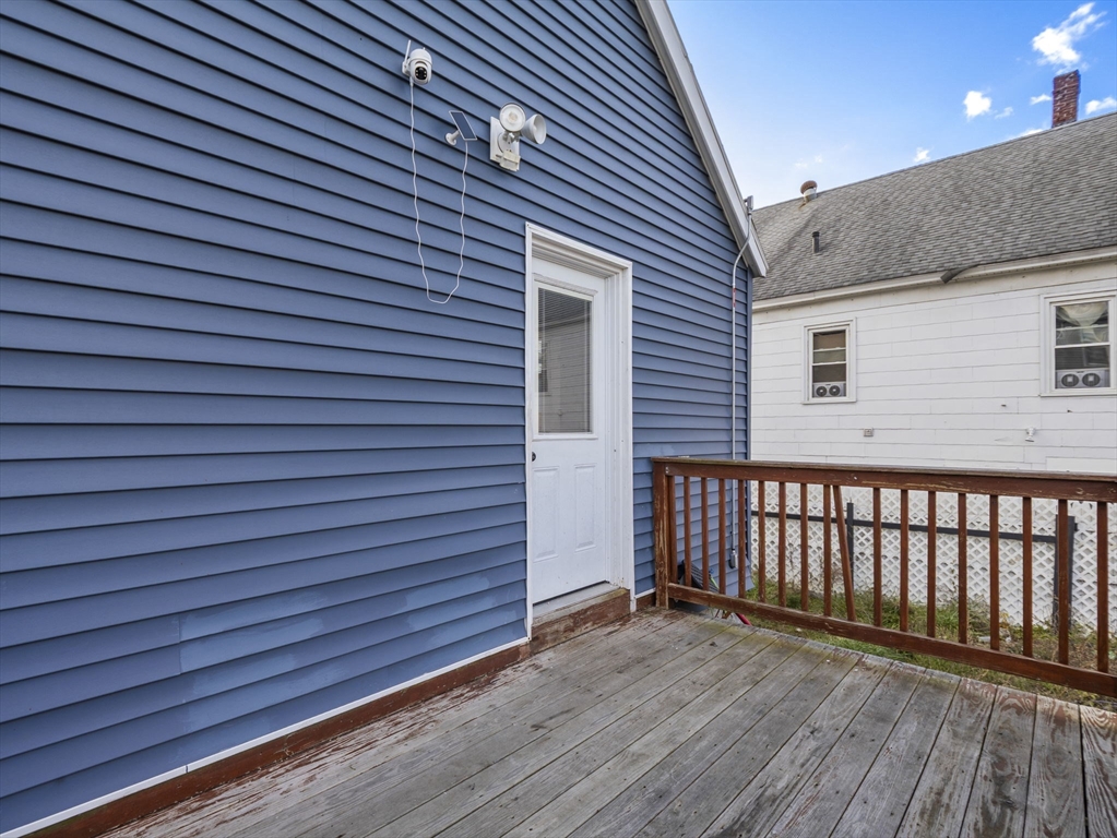 95 South Highland Street Lowell, MA 01852 - Photo 33 of 41 a view of a house with wooden deck