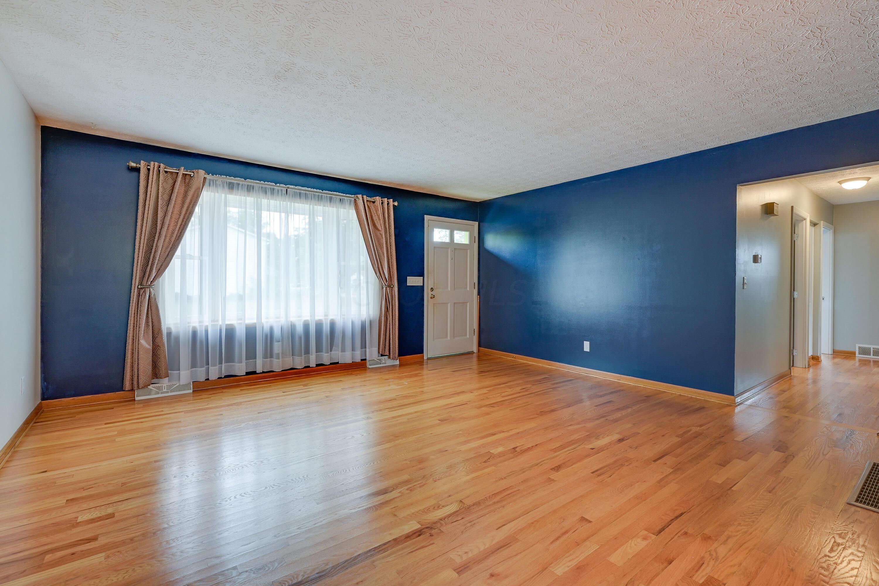 5383 Pine Bluff Road Columbus, OH 43229 - Photo 6 of 32 Living Room with beautiful hardwood floors