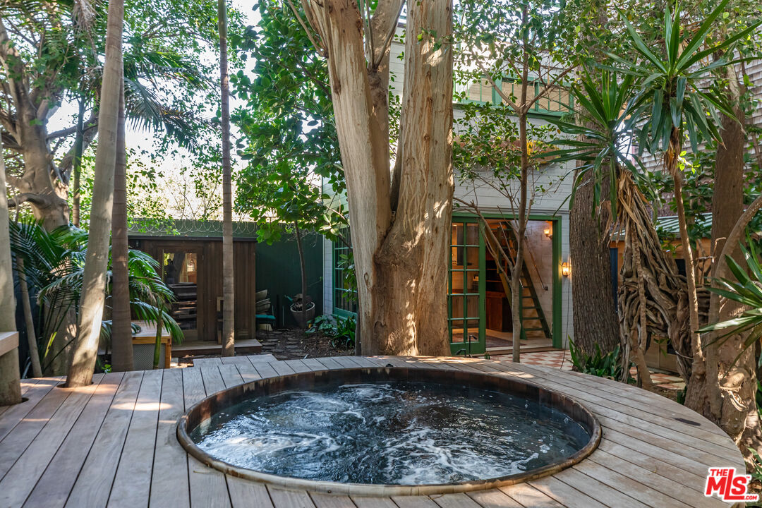 23441 Malibu Colony Road Malibu, CA 90265 - Photo 18 of 43 a view of a backyard with plants and large tree