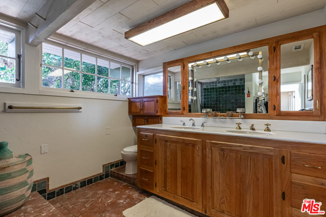 23441 Malibu Colony Road Malibu, CA 90265 - Photo 24 of 43 a view of a bathroom with sink and mirror