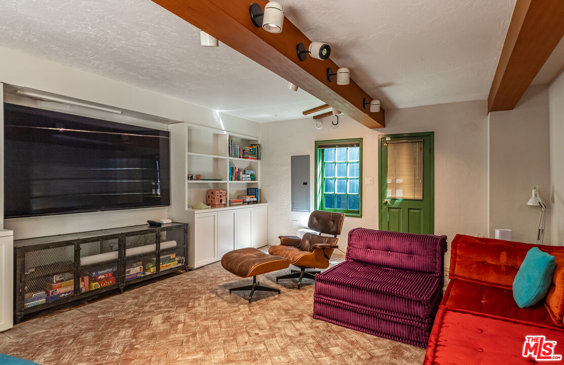 23441 Malibu Colony Road Malibu, CA 90265 - Photo 27 of 43 a living room with furniture and a flat screen tv