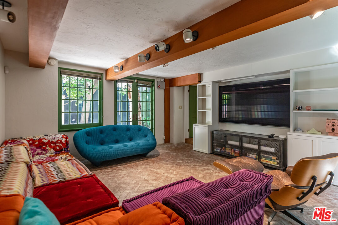 23441 Malibu Colony Road Malibu, CA 90265 - Photo 28 of 43 a living room with furniture and a flat screen tv
