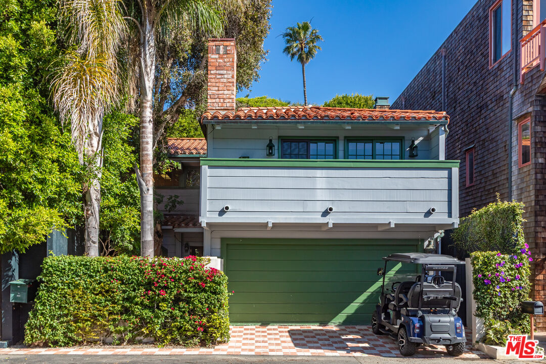 23441 Malibu Colony Road Malibu, CA 90265 - Photo 3 of 43 a front view of a house with a garden