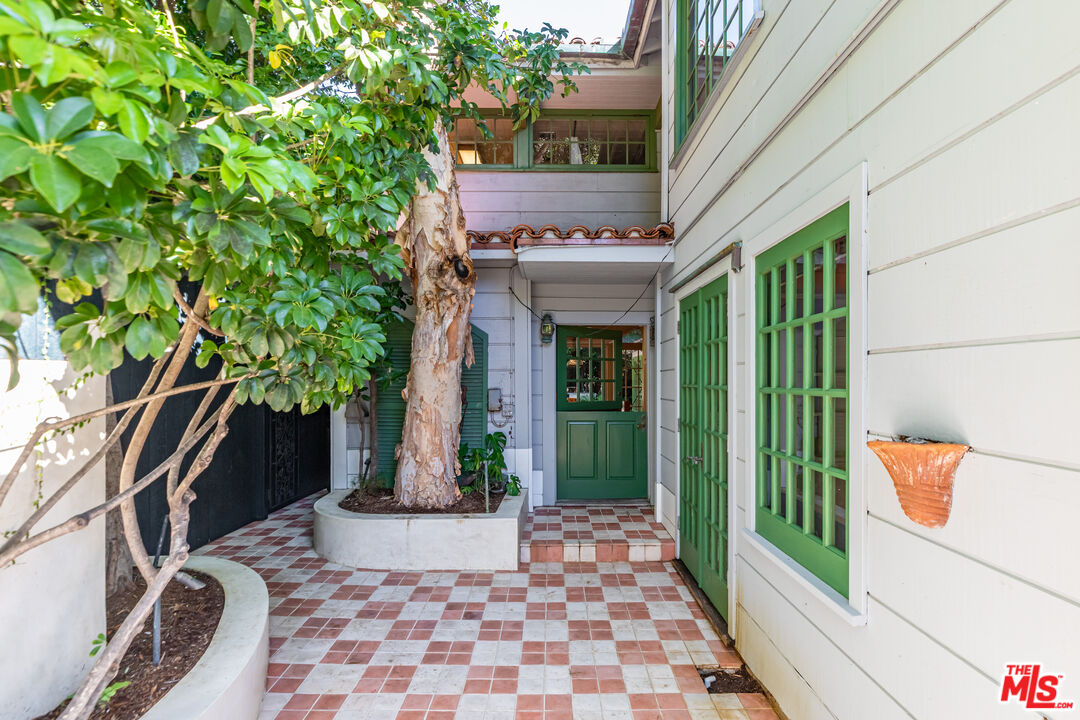 23441 Malibu Colony Road Malibu, CA 90265 - Photo 5 of 43 a picture of a brick wall with a small yard