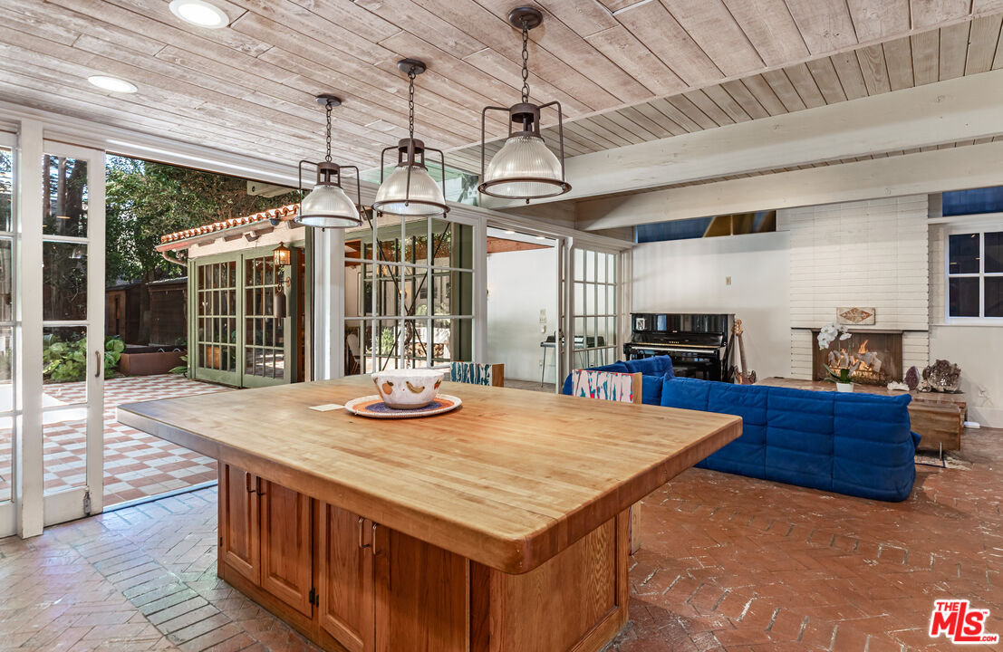 23441 Malibu Colony Road Malibu, CA 90265 - Photo 6 of 43 a view of a dining room with furniture wooden floor and chandelier